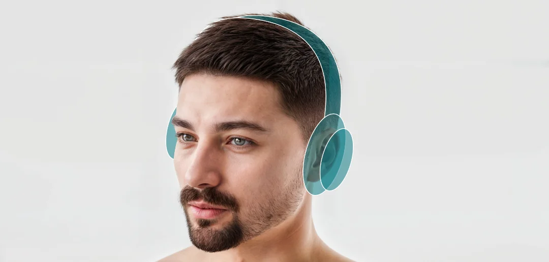 A wearing headphones showing ergonomics