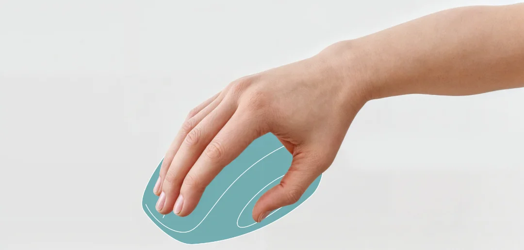 A hand holding a computer mouse showing ergonomics